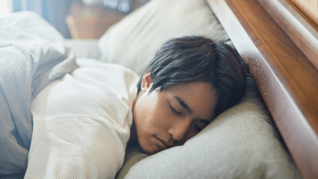 A person is sleeping in bed