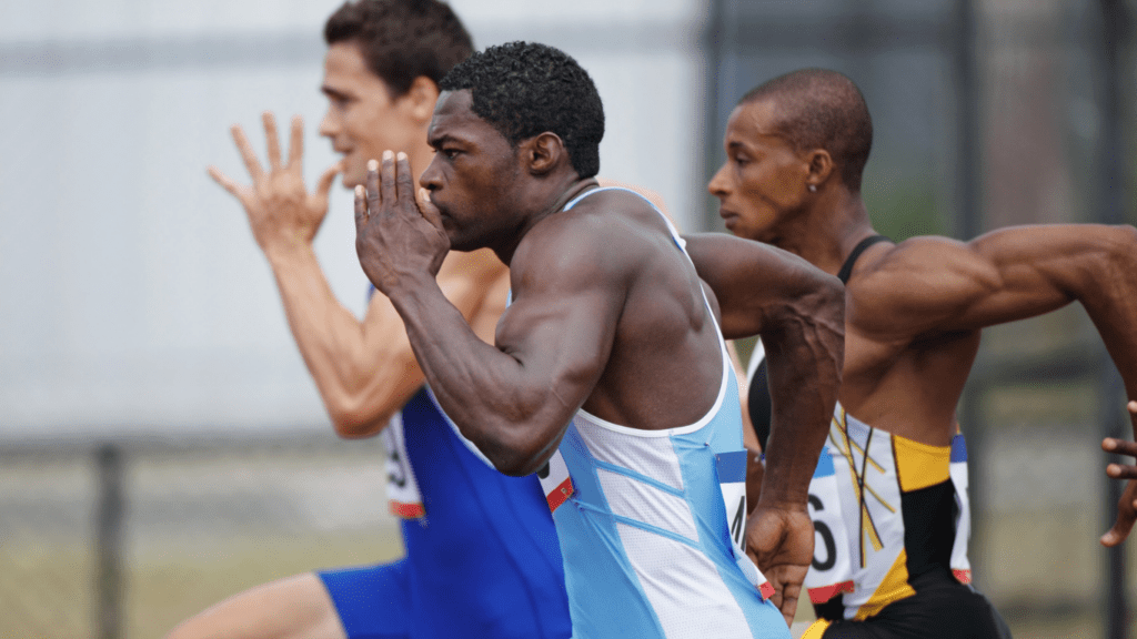 a group of athletes running on a track