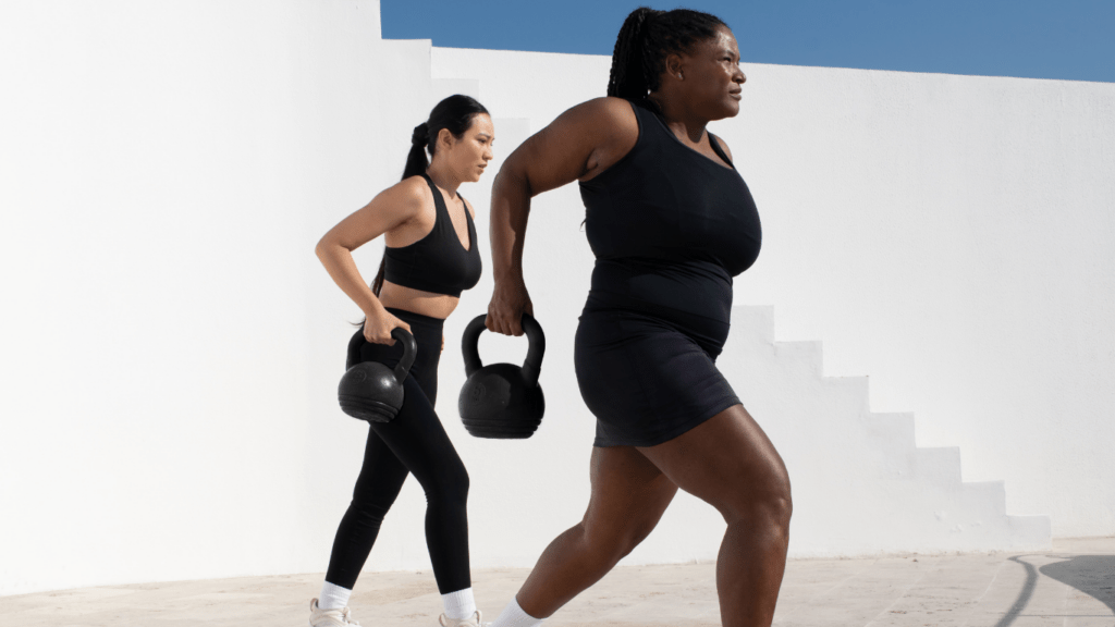 Two people doing dumbbell exercises
