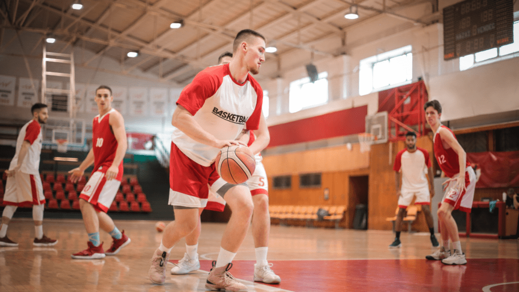 A group of people playing basketball