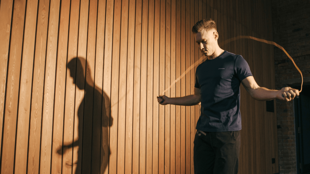 a person is jumping in the air with a skipping rope