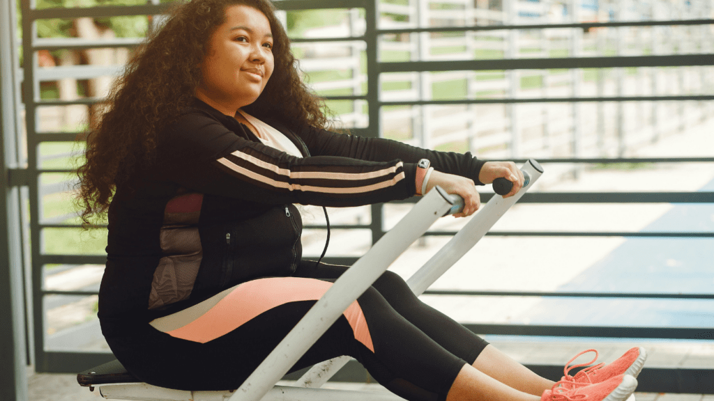 Someone is sitting on an exercise bike