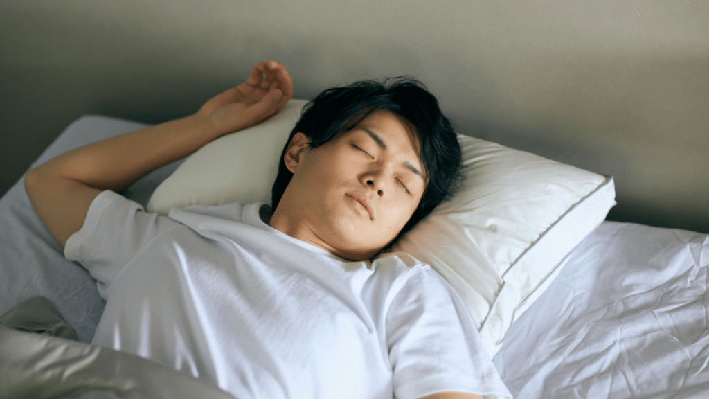 A person is sleeping in bed
