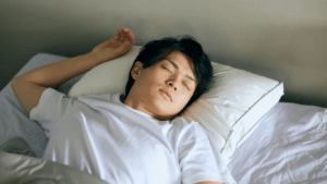 A person is sleeping in bed