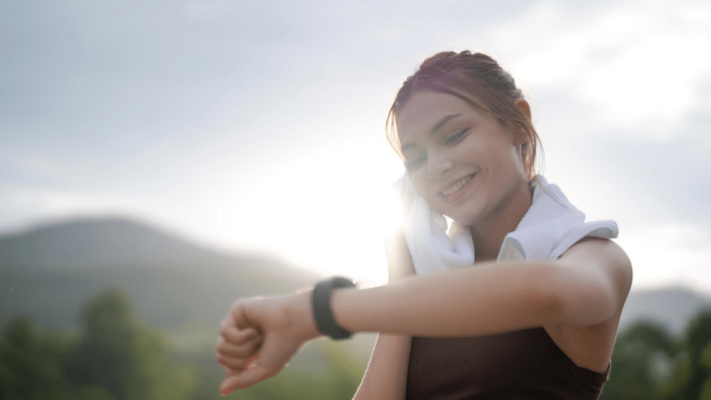 a person is standing on the side of the road looking at their watch