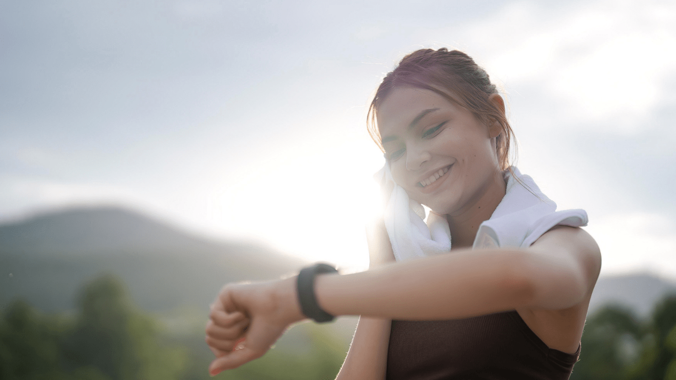 a person is standing on the side of the road looking at their watch