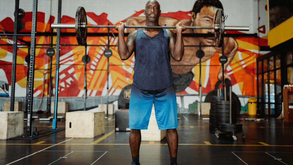 a person is lifting a barbell