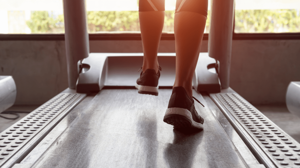 a person running on a treadmill in a gym